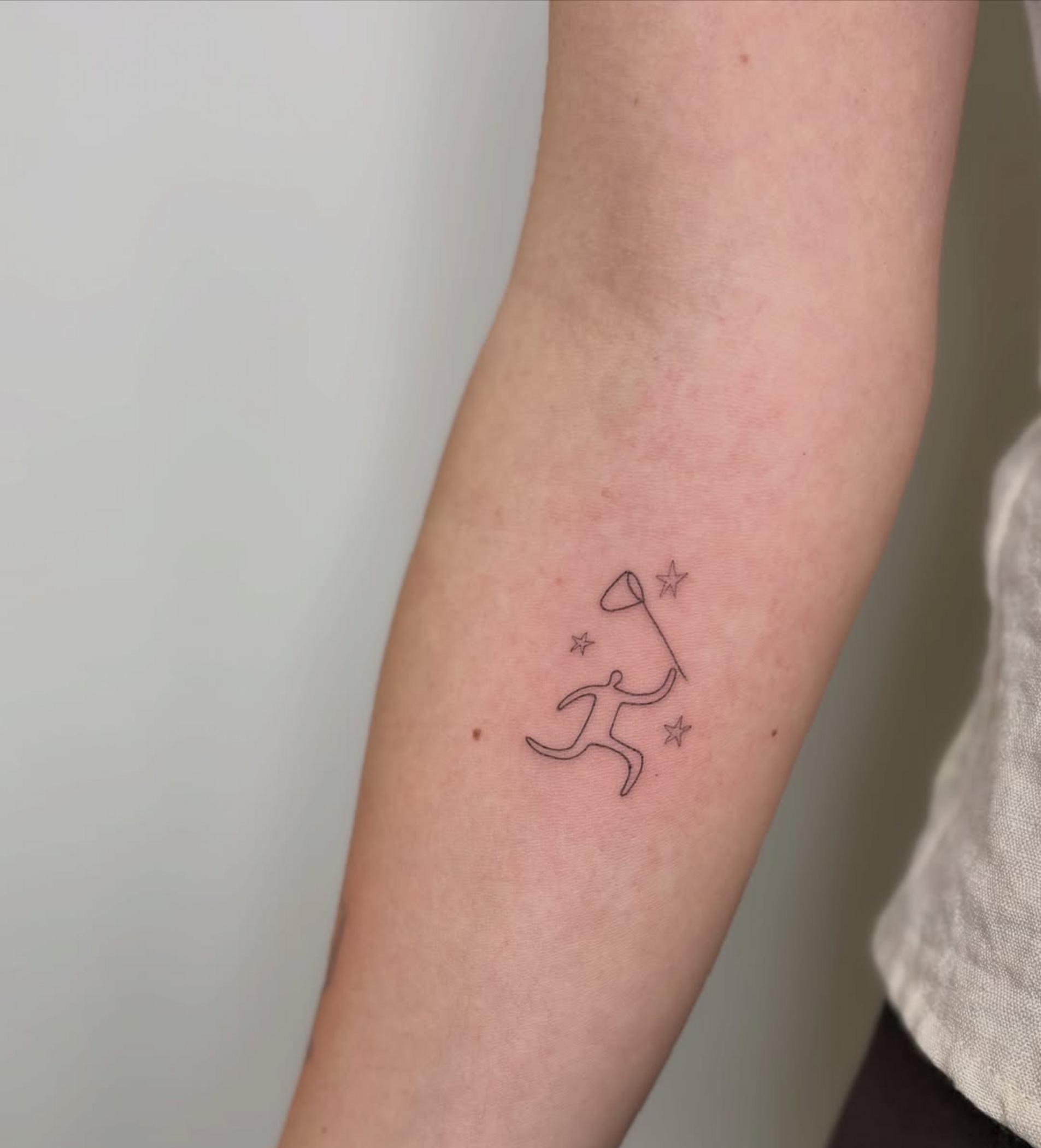 close up single needle tattoo lines