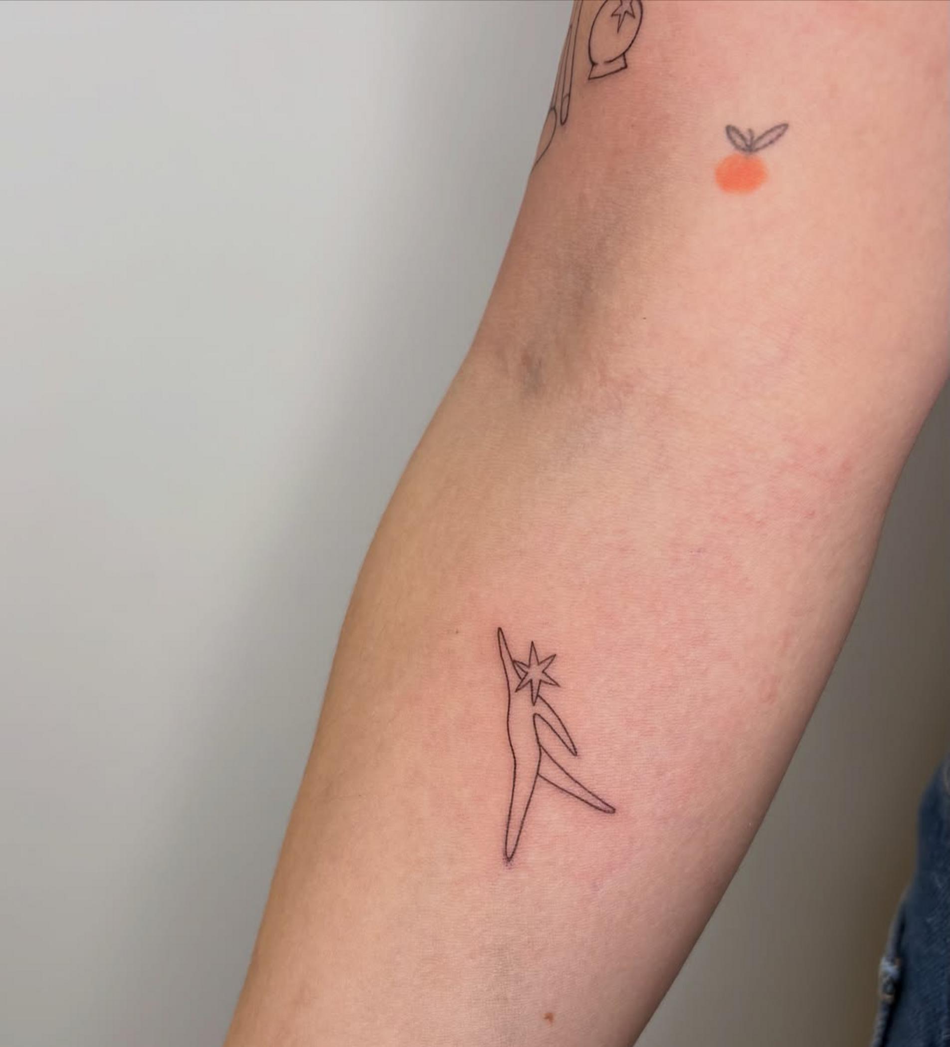 early stage healing single needle tattoo