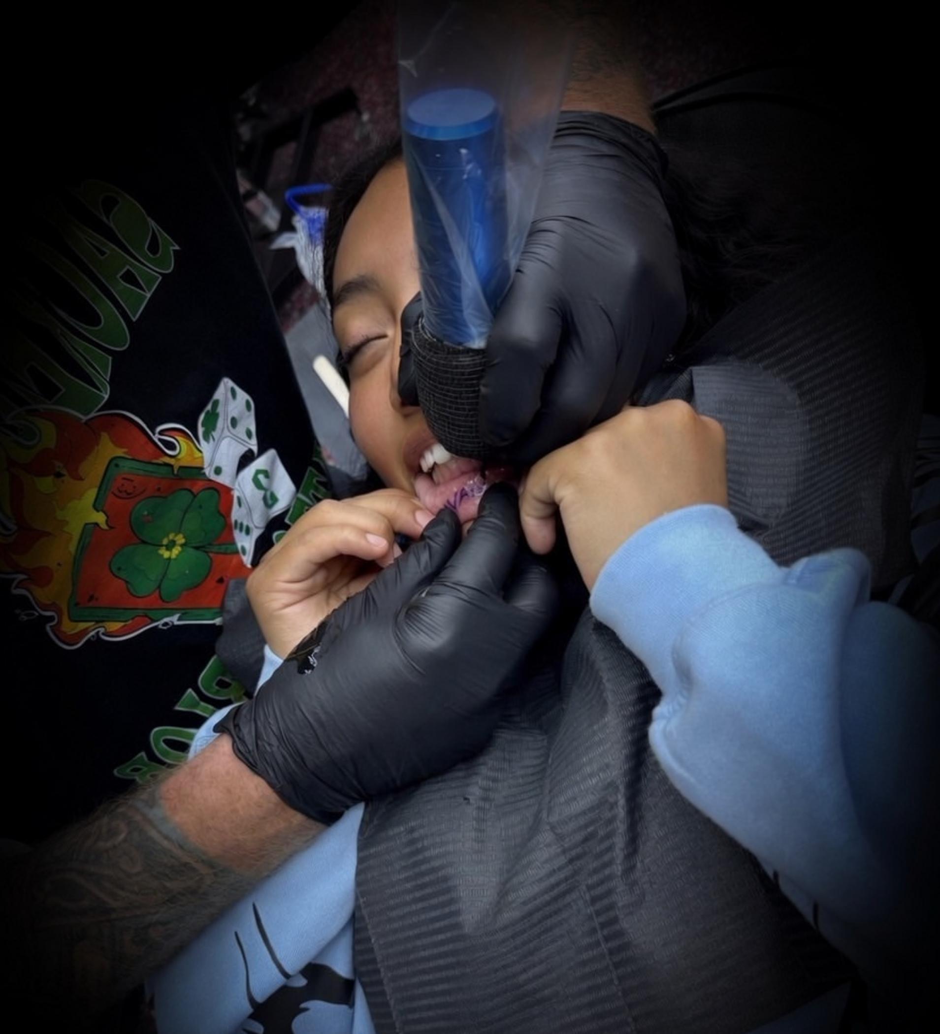 lip tattoo procedure in progress
