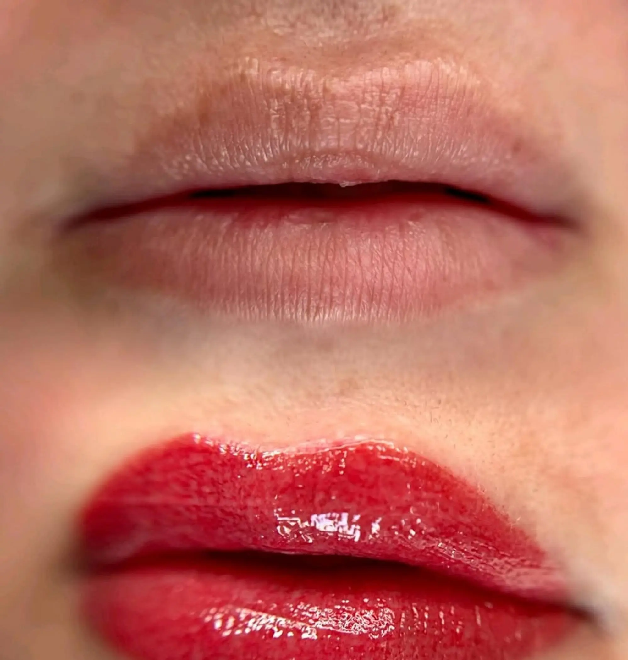technician applying permanent lip makeup